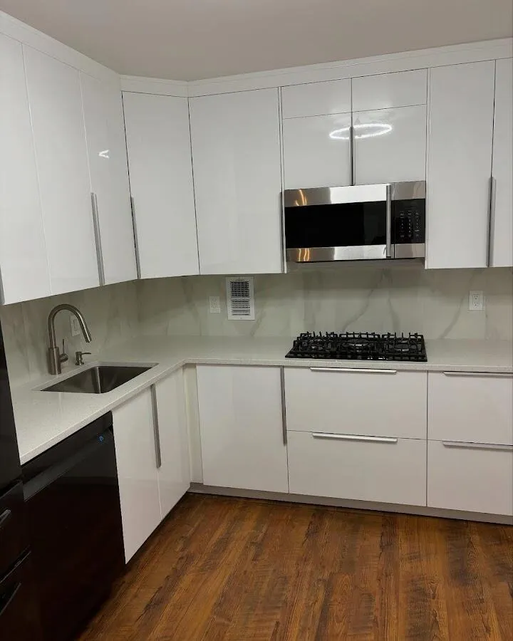Restored kitchen with white cabinets after water damage in Carlstadt